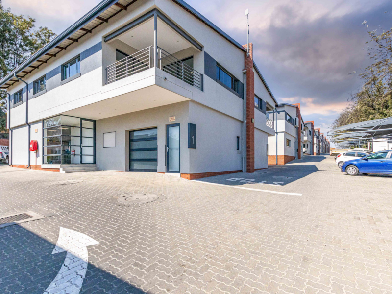 exterior of innovation worx - business park showing commercial units and on-site parking