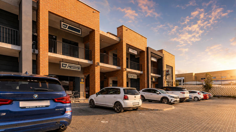 exterior of innovation worx - 16th road with cars in the on-site parking